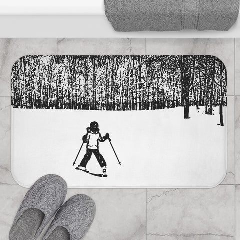 a bathroom rug with a picture of a skier on it