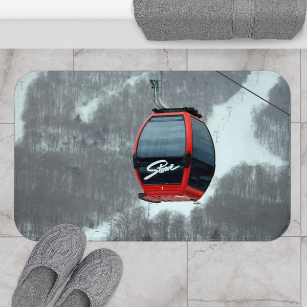 a ski lift with a pair of feet on the ground