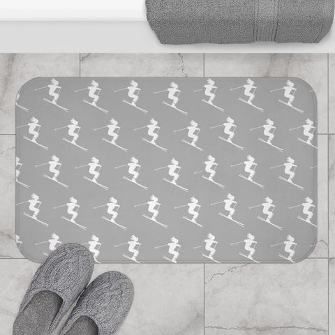 a bathroom rug with a skier pattern on it