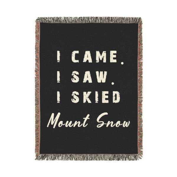 A black woven throw blanket with fringed edges, featuring the text 'I CAME. I SAW.