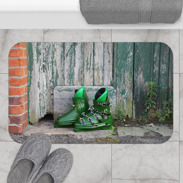 a pair of green shoes sitting in front of a wooden fence