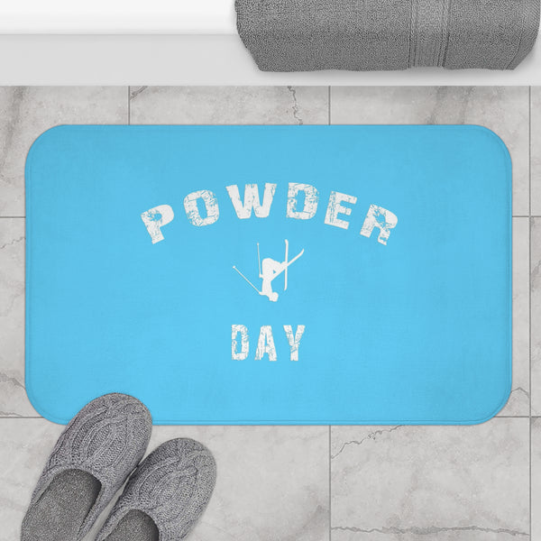 a blue rug with the words powder day on it
