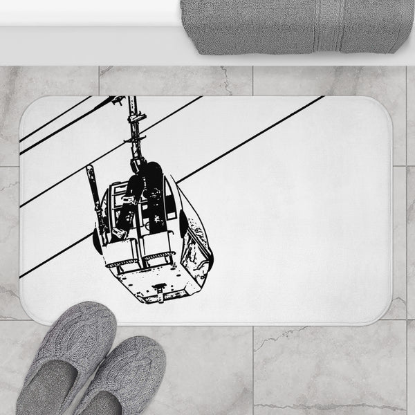 a bathroom rug with a picture of a cable car