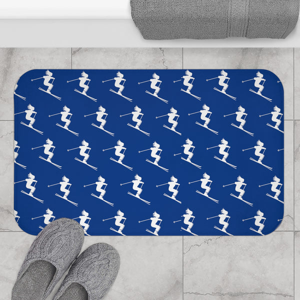 a person standing on a tile floor with skis on it