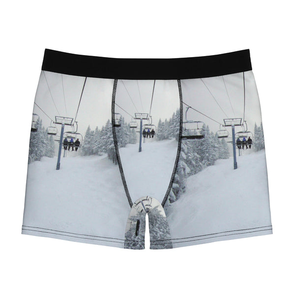 a pair of underwear with a ski lift in the background