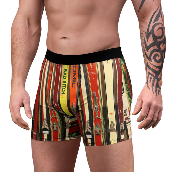 a man with a tattoo on his arm wearing a pair of boxer shorts