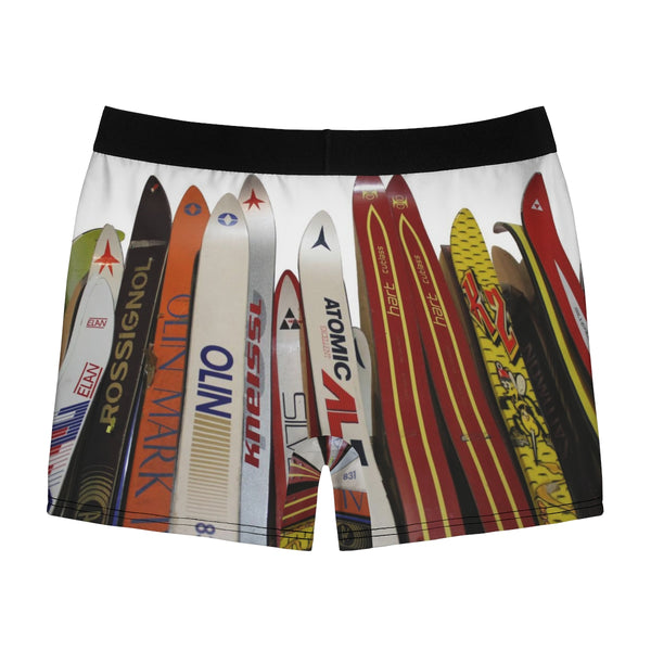 a pair of men's shorts with surfboards printed on them